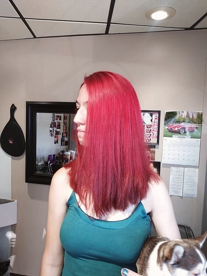Salon client with a bold color result and clean, defined brows in Louisville