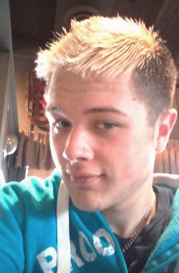 Men's short cut with blonde highlights at Bon Air Barbershop in Louisville, KY