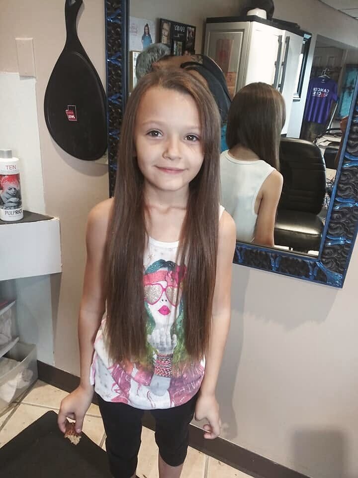 Precision haircut in the chair at Blown Away Salon on Poplar Level Road