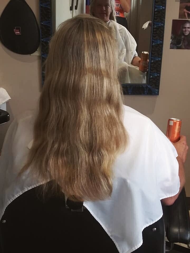 Long layered hair styled in the chair at Blown Away Salon in Louisville